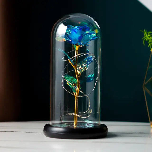 Close-up of artificial flowers in a glass dome, adding elegance to your room.