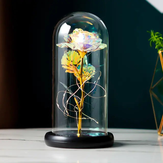 Gorgeous artificial floral arrangement in a glass dome to elevate any room.