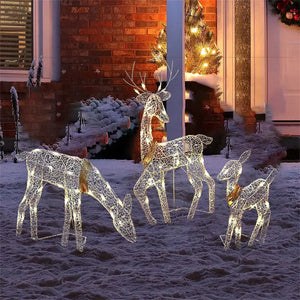 Elegant 3-piece LED wrought iron deer set lit up for a magical Christmas outdoor display.