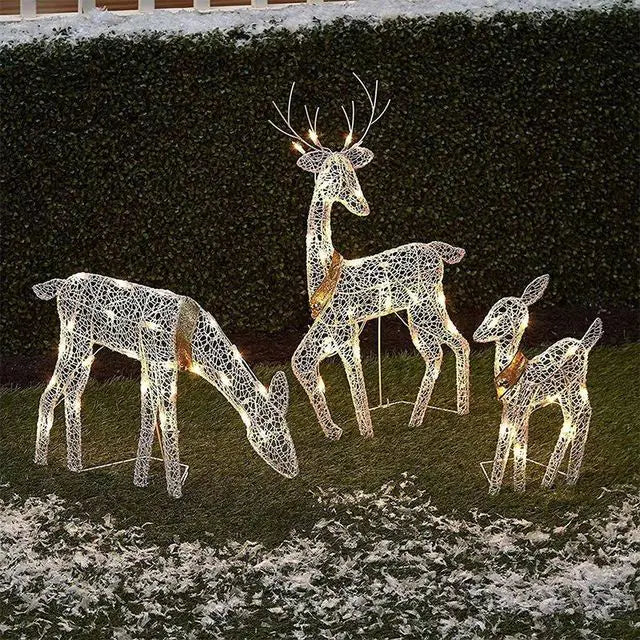 Holiday decoration featuring a 3-piece LED wrought iron deer set glowing with bright festive lights.